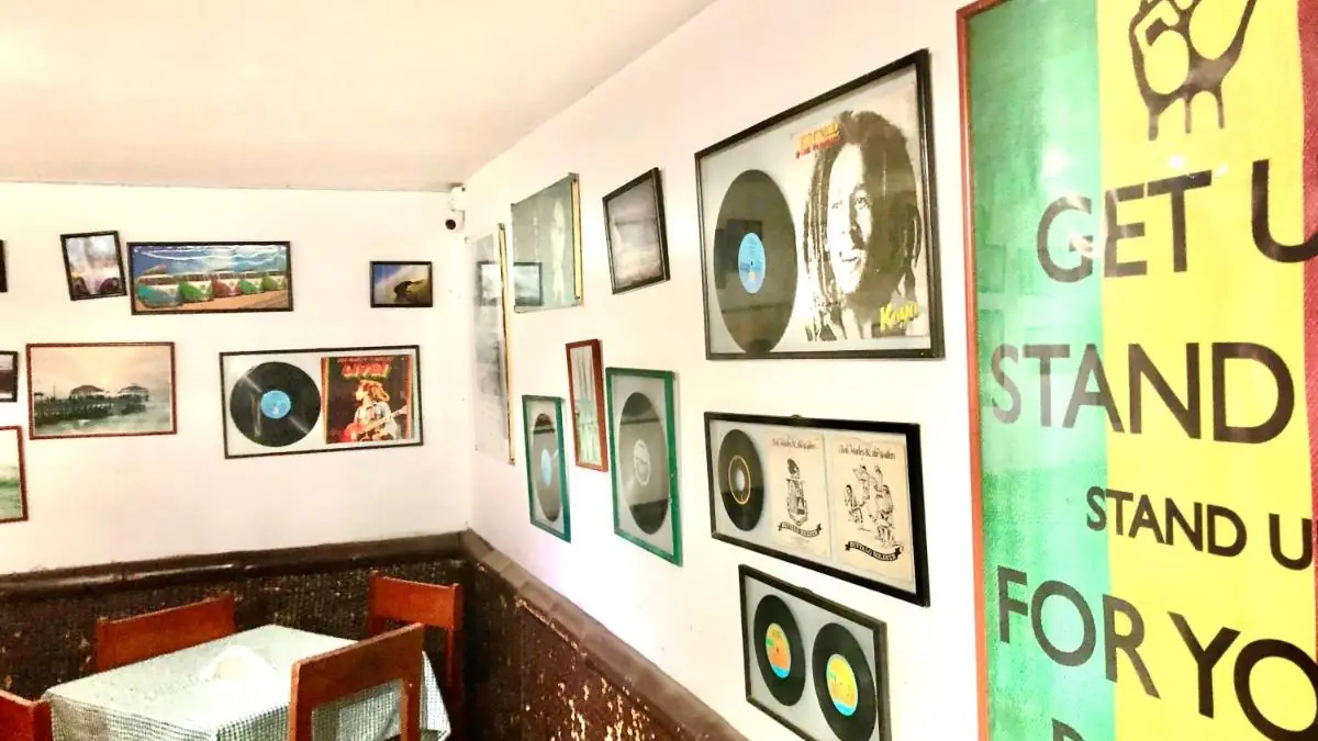 Lounge at My Friend Surf Hostal, with records and pictures on the wall